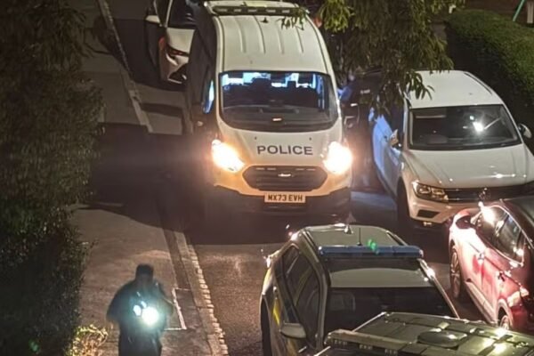 Police descend on Manchester street with man seriously hurt and woman arrested