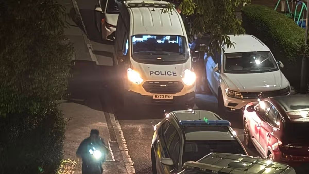 Police descend on Manchester street with man seriously hurt and woman arrested