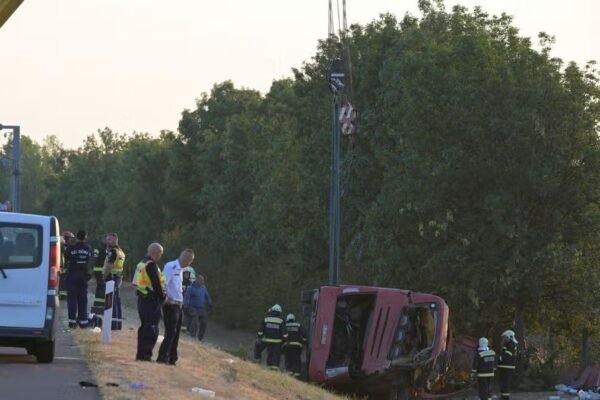 Bus crash sees 12 killed and several injured as vehicle overturns 'trapping passengers'