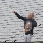 Man wearing Leonardo DiCaprio jumper launches tiles off roof in 40 hour police stand-off