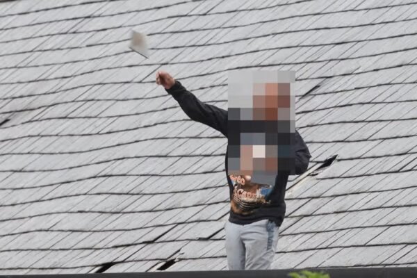 Man wearing Leonardo DiCaprio jumper launches tiles off roof in 40 hour police stand-off