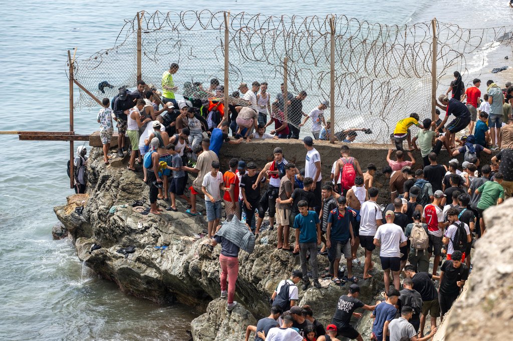 The AP reveals how false online rumors drove a migrant surge from Morocco to Spain, breaking news on a highly competitive story