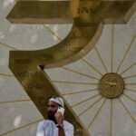 Indian central bank keeps up interventions to cushion rupee from oil strain, traders say