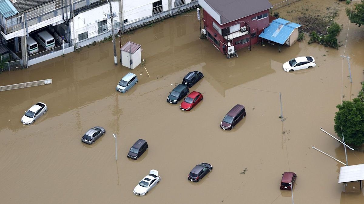 Four killed in Japan after record-breaking rainfall floods homes and roads