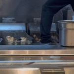 Video captures Panda Express worker standing near fryer during meal prep