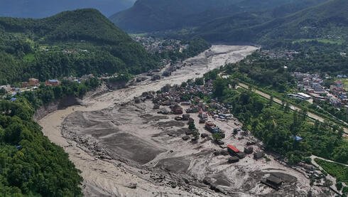 Death toll from Nepal floods rises to 22, India evacuates residents near border