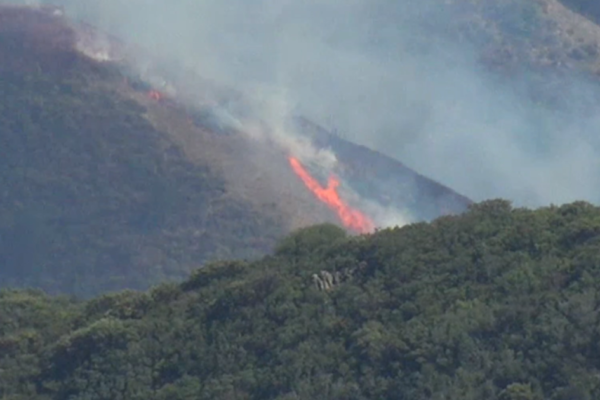 Grade Fire Halted: Crews Corral 33-Acre Blaze After Critical Stand
