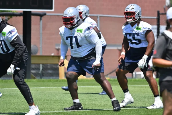 Patriots’ Linchpin: Mike Onwenu’s Status Clouded Amid Critical Injury Update