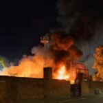 Plumes of Panic: Massive Scrap Yard Inferno Engulfs Liverpool Skyline