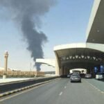 Riyadh Skyline Aglow: Smoke and Flames Erupt Near Airport Following Aerial Threat Warning