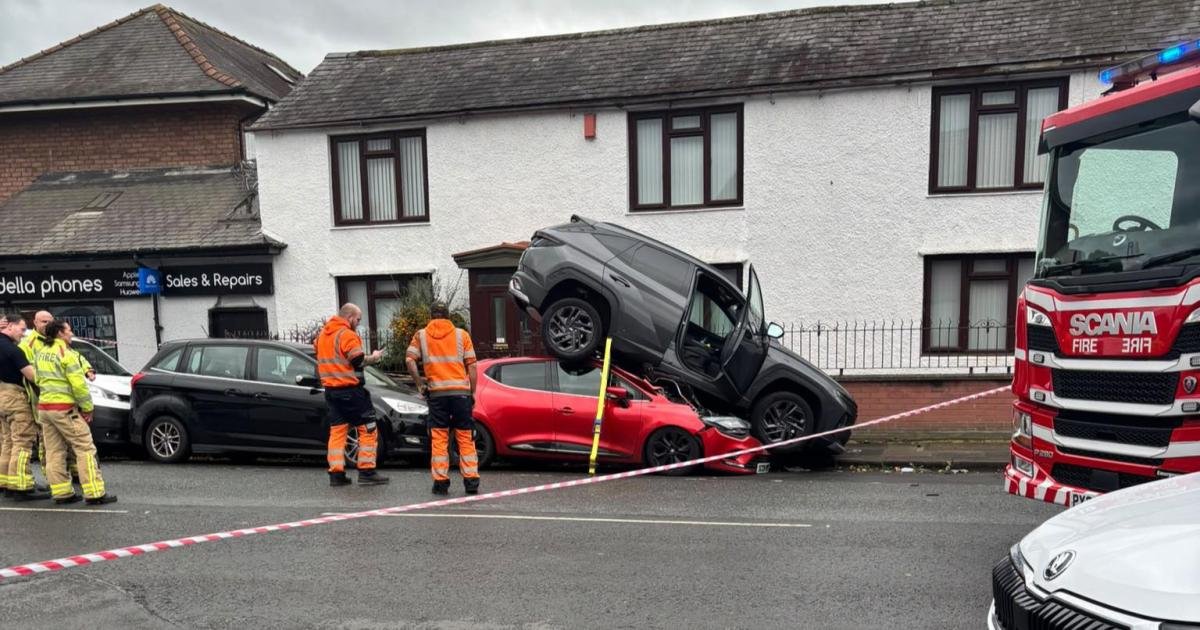 Upside-Down Commute: SUV Lands Atop Sedan in Freak City Intersection Crash