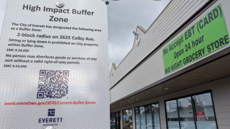 Sidewalk Standoff: Business Owners Divided as 'No Sit' Signs Claim Main Street
