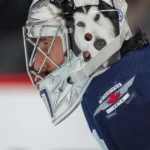 The Heavy Price of Absence: What Connor Hellebuyck Loses With Every Day Off the Ice
