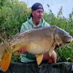 Titan of the Tangle: Local Angler Shatters Lake Record with Monster Catch
