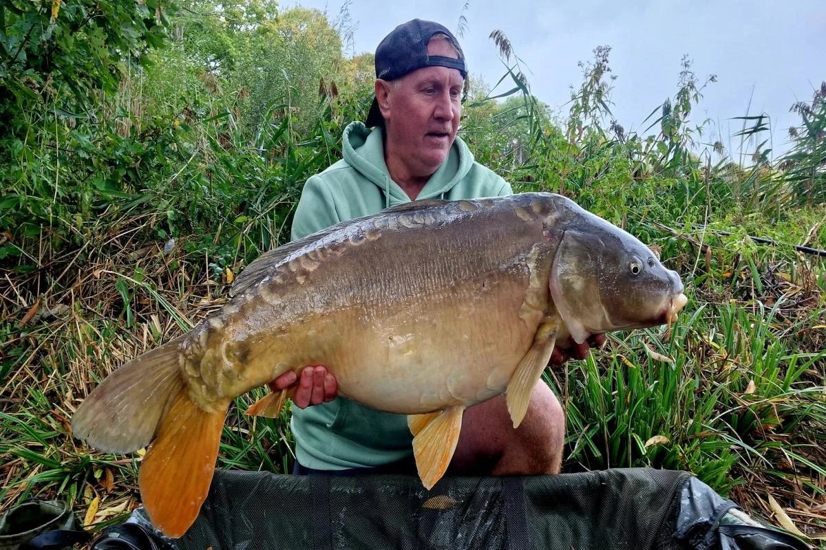 Titan of the Tangle: Local Angler Shatters Lake Record with Monster Catch