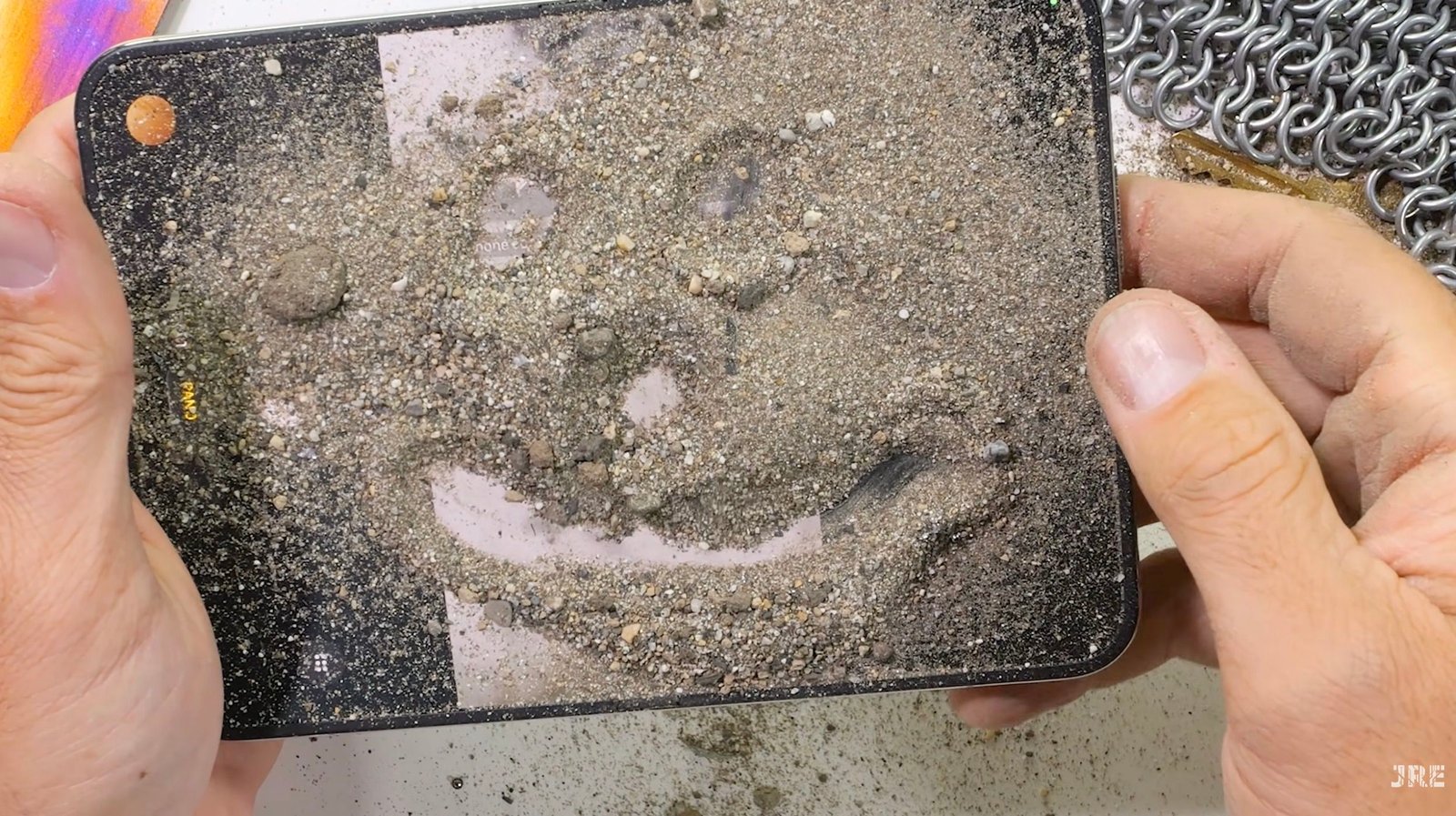 iPhone Duo Crumples Under Pressure: JerryRigEverything’s Dust Test Exposes Critical Flaw